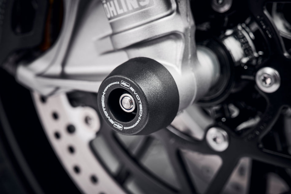 The robust nylon EP Spindle Bobbins Kit attached to the front wheel of the Triumph Speed Triple 1200 RS.