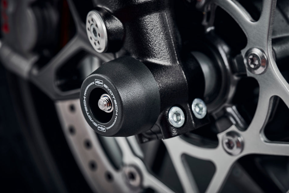 The front fork of the Triumph Street Triple 765 RS fitted with Evotech Performances signature crash slider from EP Front spindle Bobbins, protecting the forks and brake calipers.