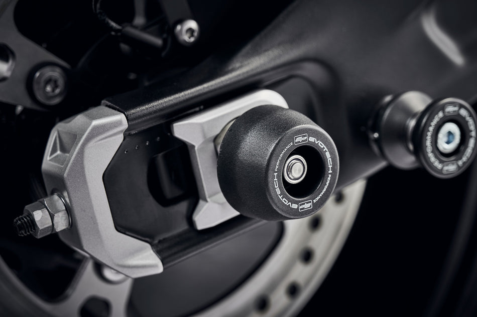 The rear wheel and swingarm of the Triumph Trident with EP Rear Spindle Bobbins installed to give Evotech Performances crash protection to the motorcycles rear end. 