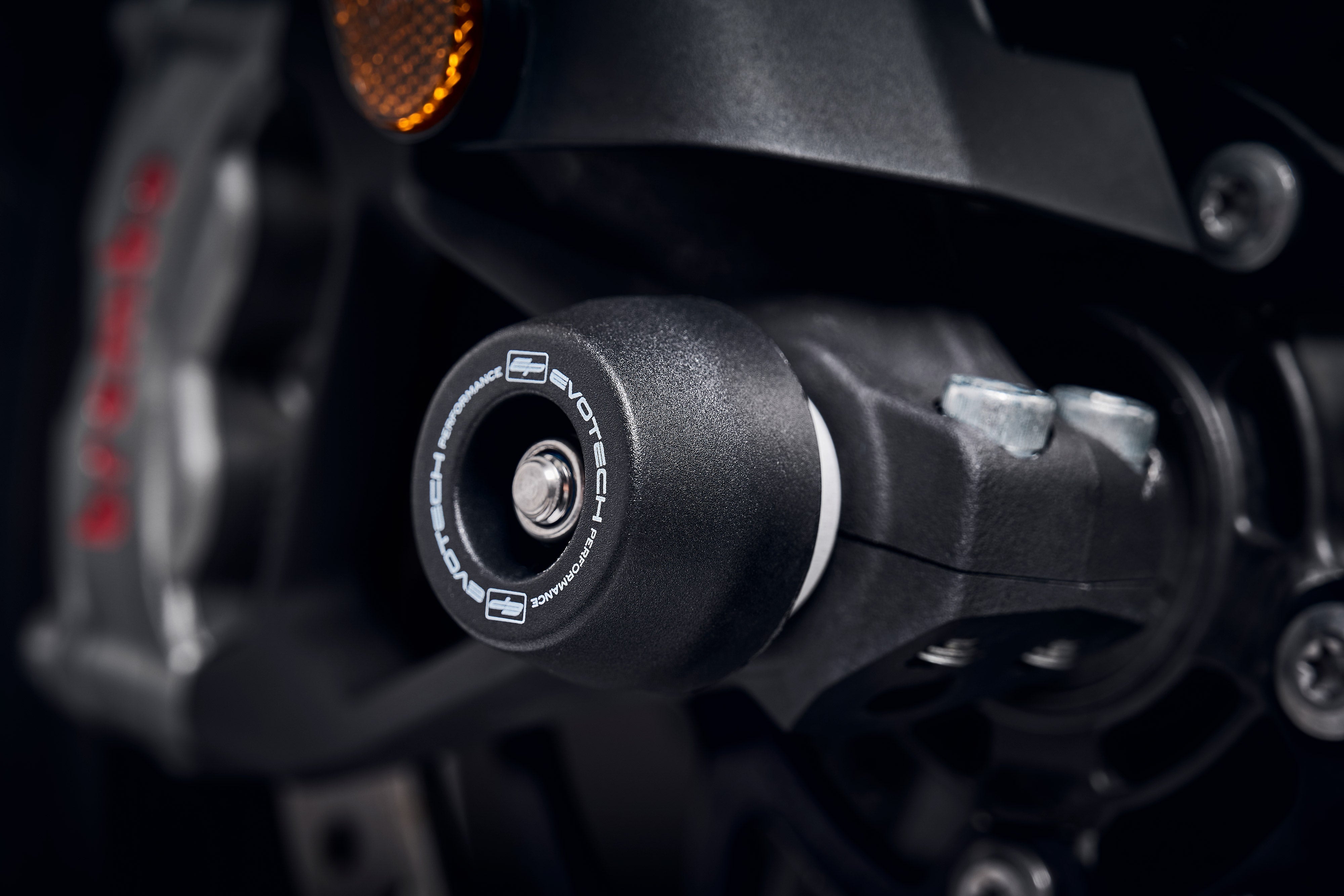 The signature EP Spindle Bobbins Kits crash protection bobbin mounted through the front fork of the Triumph Tiger 1200 GT.