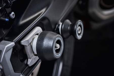 The rear wheel and swingarm of the Triumph Tiger Sport 660 with EP Rear Spindle Bobbins installed to give Evotech Performances crash protection to the motorcycles rear end. 