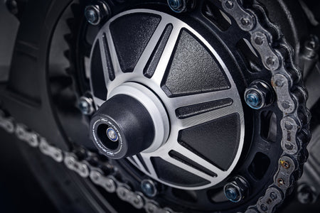The EP Spindle Bobbin Kit signature bobbin is attached to the rear wheel of the Honda CB1000R Neo Sports Cafe, guarding the swingarm and drive chain.