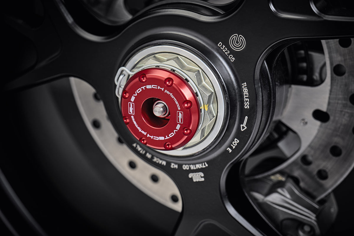 The anodised red hub stop of the EP Rear Spindle Bobbins Crash Protection fitted to the offside rear wheel of the Ducati Streetfighter V4 SP.