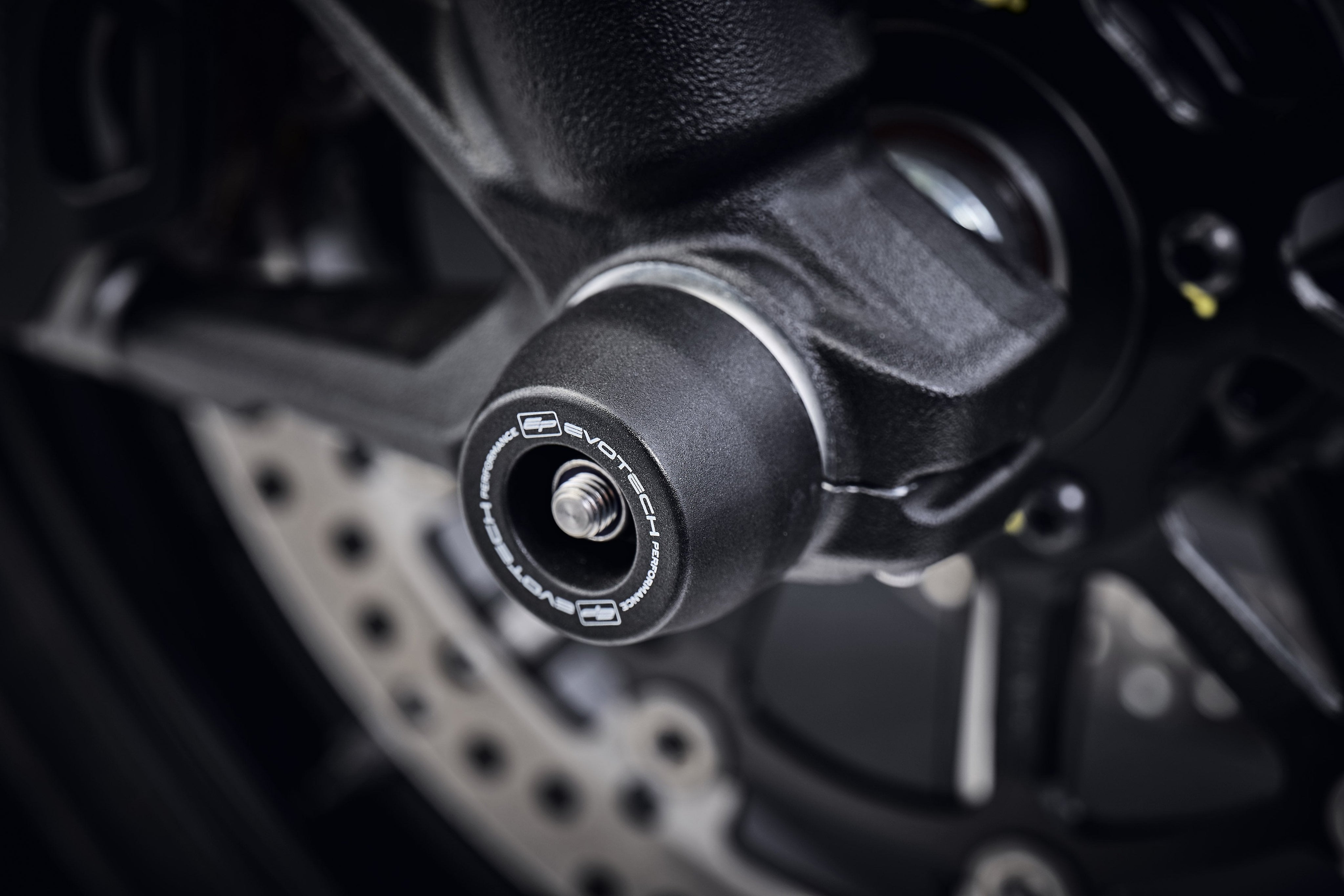 The front wheel of the Ducati Scrambler 1100 Tribute Pro with EP Spindle Bobbins Crash Protection Kit fitted.