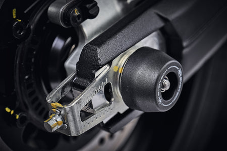 The precision fit of the signature EP Spindle Bobbins Kit to the swingarm and rear wheel of the Ducati Scrambler Icon Dark.