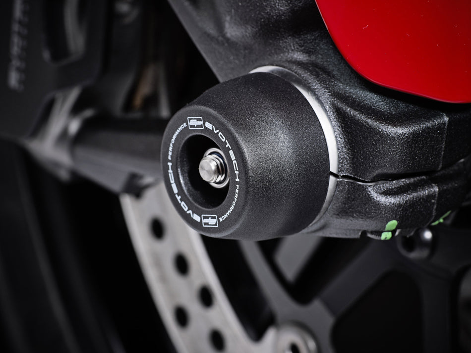 The front wheel of the Ducati Scrambler Italia Independent featuring EP Front Spindle Bobbins crash protection, one half of the EP Spindle Bobbins Paddock Kit. 