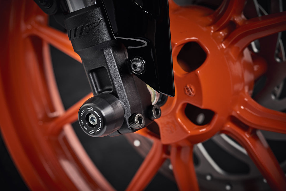 The lower front fork of the KTM 125 Duke with EP Front Spindle Bobbins securely attached, offering crash protection to the motorcycles front wheel.