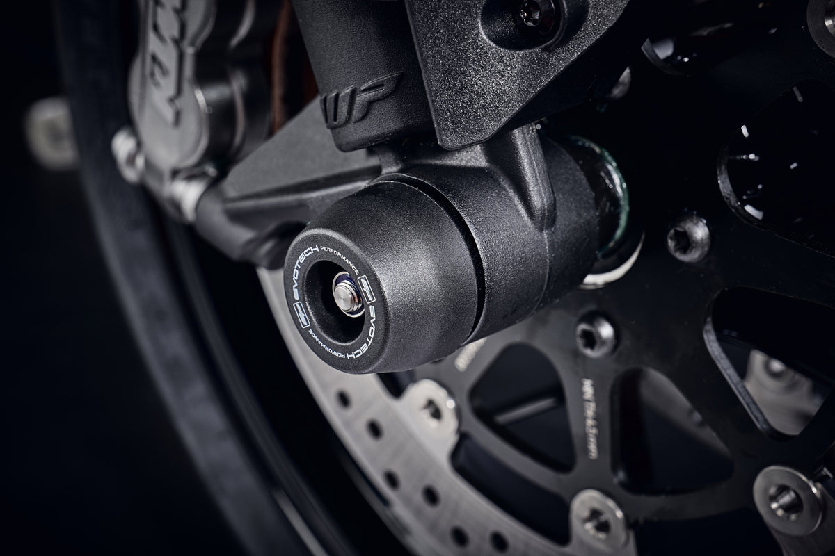 The injection-moulded nylon crash bung of EP Front Spindle Bobbins installed onto the front wheel of the KTM 890 Duke, giving strong crash protection to the front forks and brake calipers.