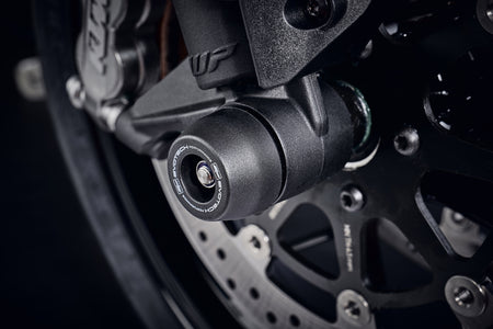 The injection-moulded nylon crash bung of EP Front Spindle Bobbins installed onto the front wheel of the KTM 890 Duke, giving strong crash protection to the front forks and brake calipers.