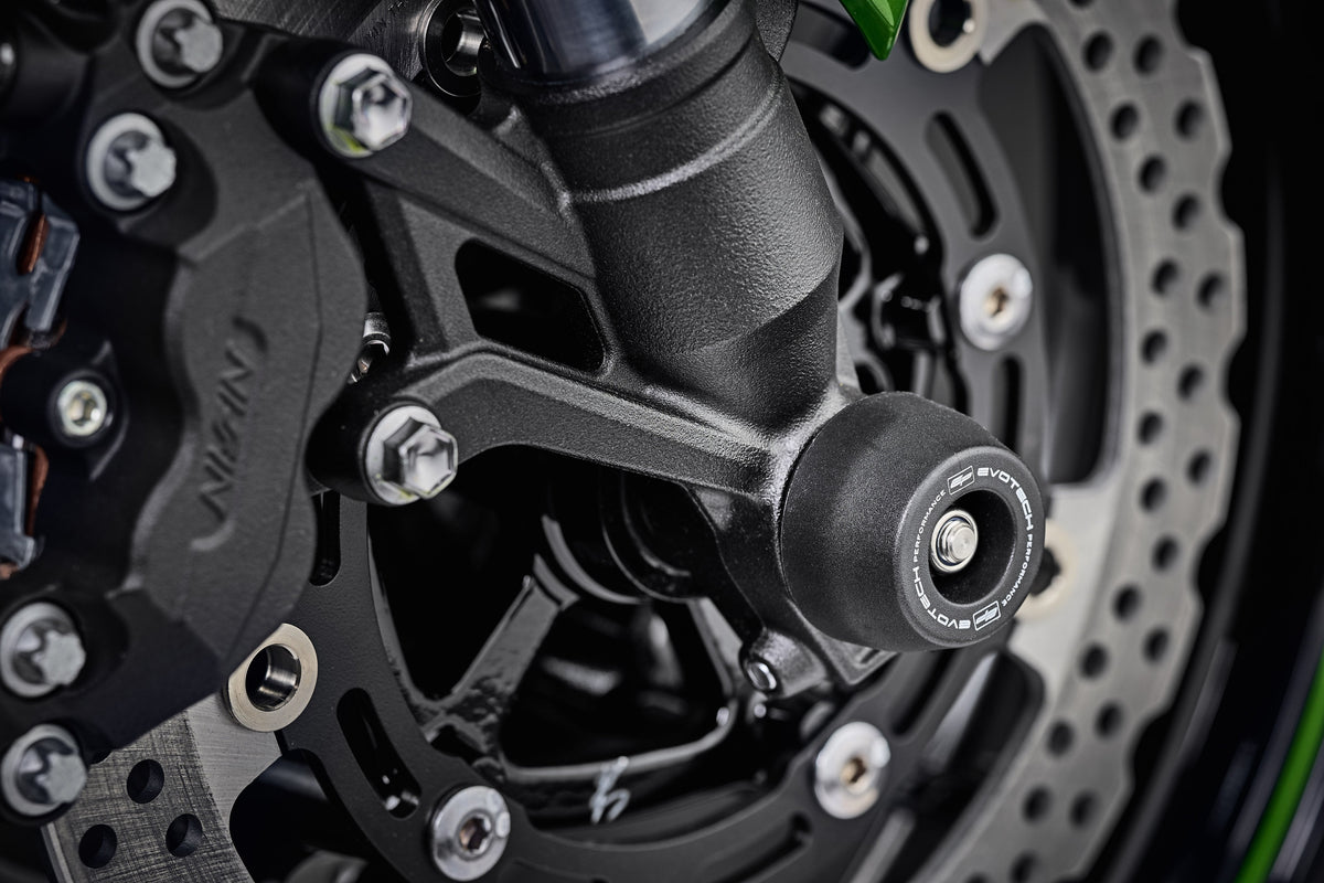 The signature EP Spindle Bobbins Kit precision fitted to the motorcycle, designed to blend with the front forks of the Kawasaki Z900RS.