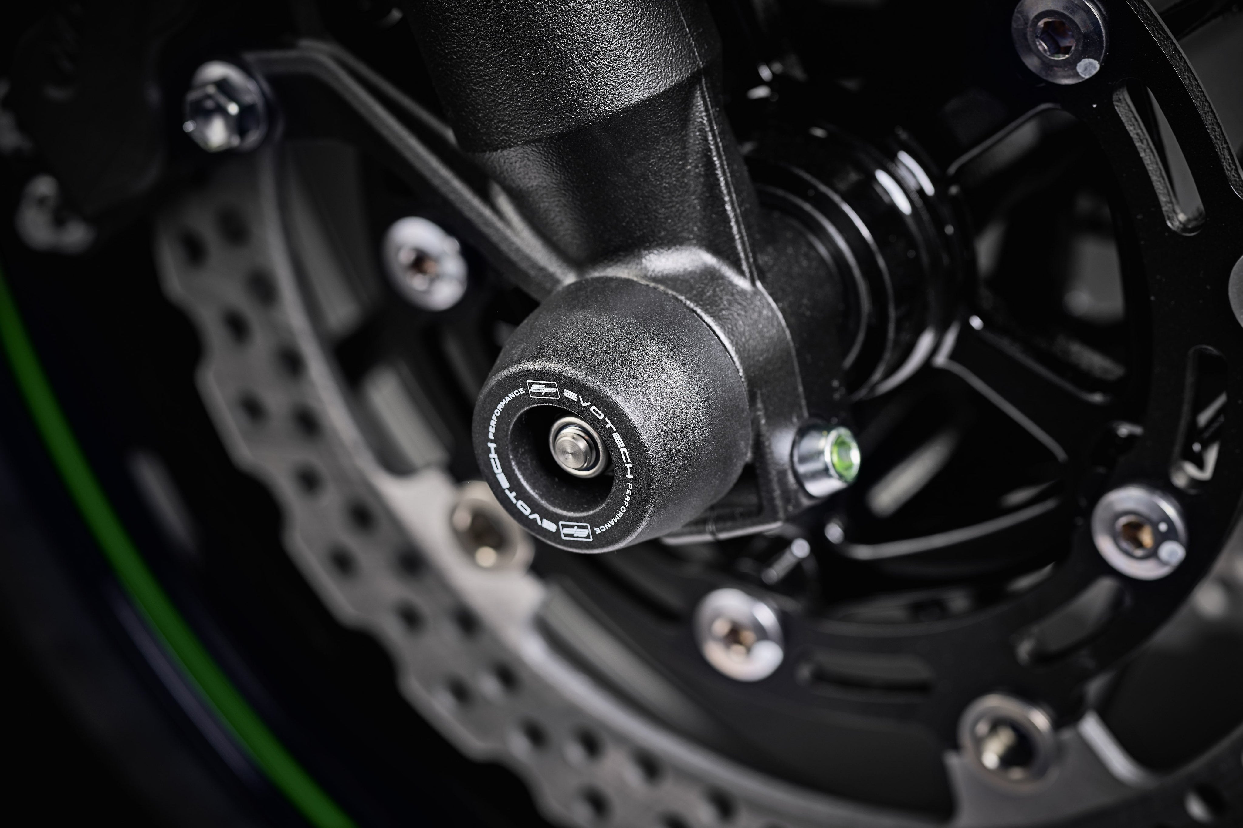 EP Spindle Bobbins Crash Protection fitted to the front wheel of the Kawasaki Z900RS shielding the front forks and brake calipers.