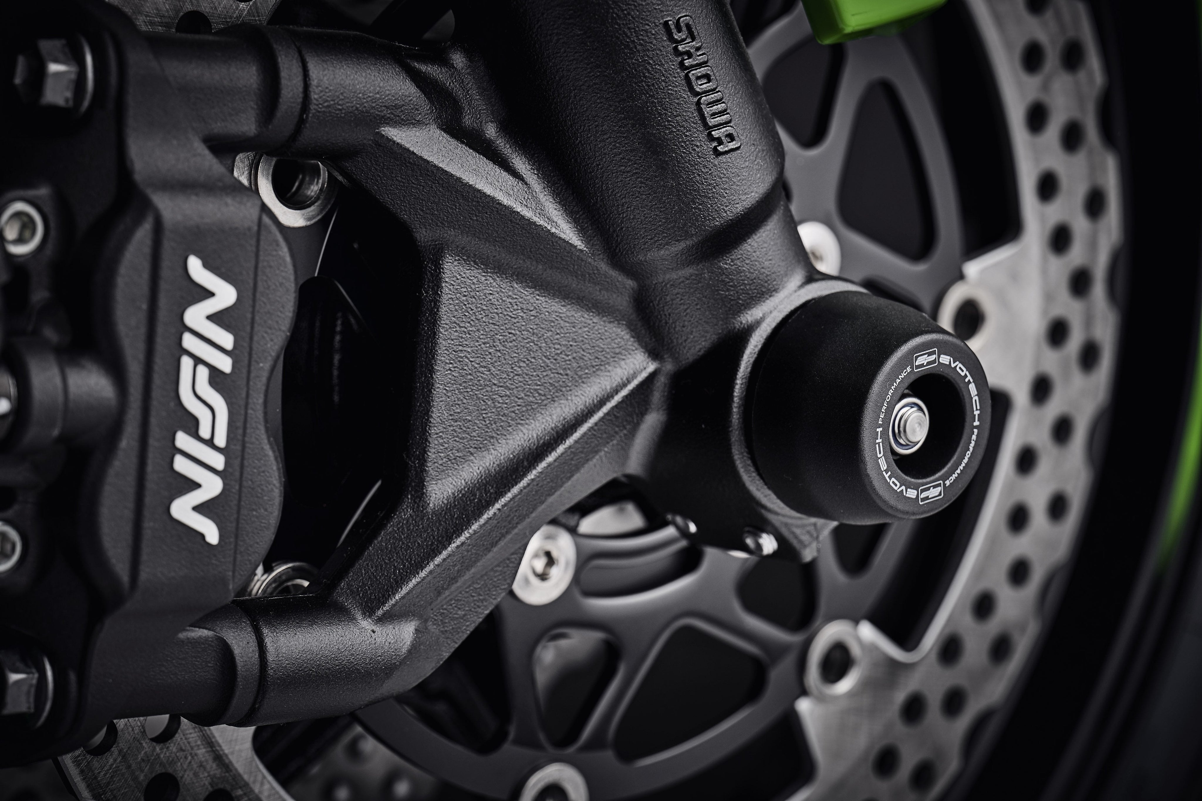 The signature EP Spindle Bobbins Kit precision fitted to the motorcycle, designed to blend with the front forks of the Kawasaki ZX6R.