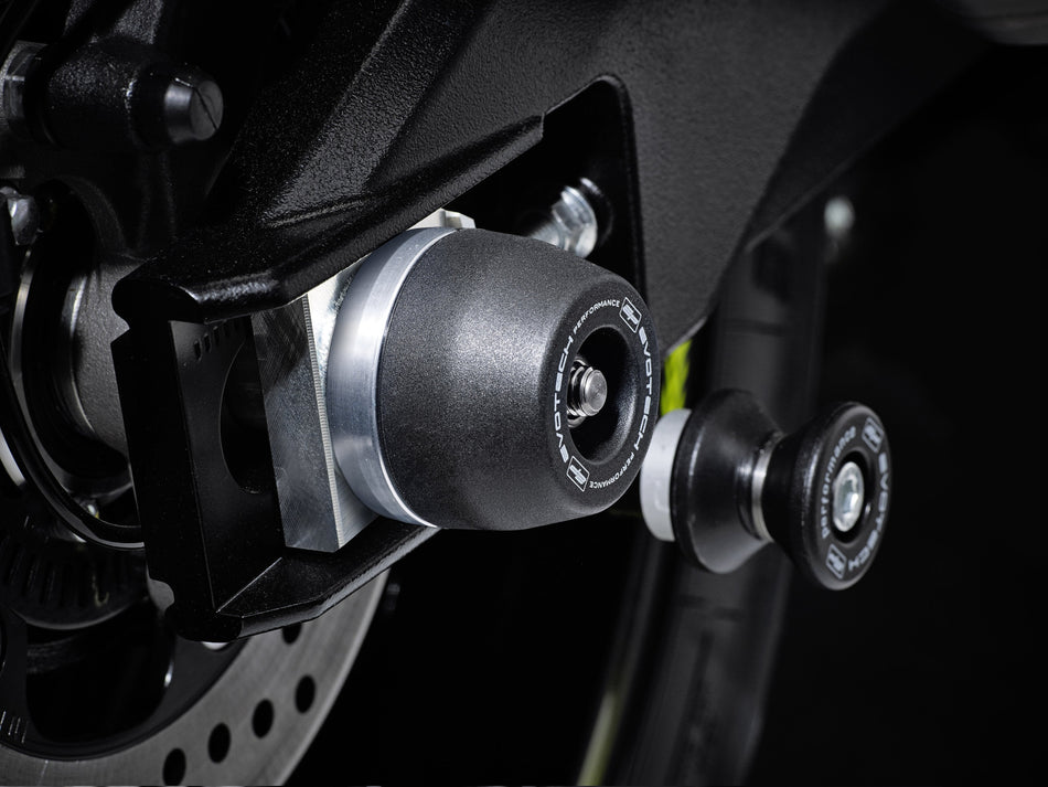 The precision fit of the EP bobbin head to the rear wheel of the Suzuki V-Strom 1050 from the EP Spindle Bobbin Kit, offering crash protection the swingarm. 